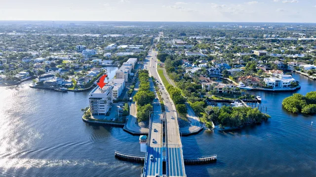 a view of a lake with boats and trees in the background