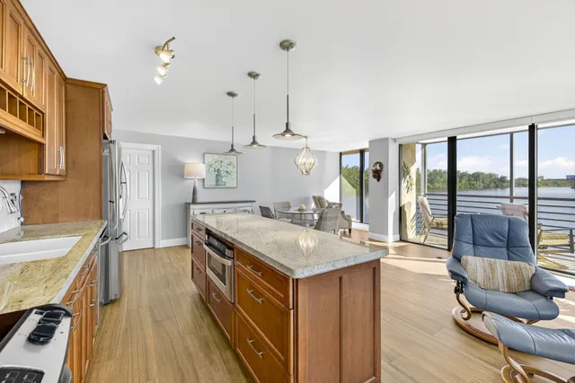a kitchen with a stove a sink and a refrigerator