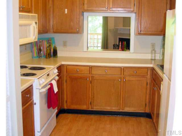 4611 Timbermill Court, Unit 202 Raleigh, NC 27612 - Photo 6 of 22 U shaped kitchen with open sight line into the family room Kitchen