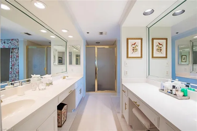 a kitchen with stainless steel appliances granite countertop a sink a stove and refrigerator