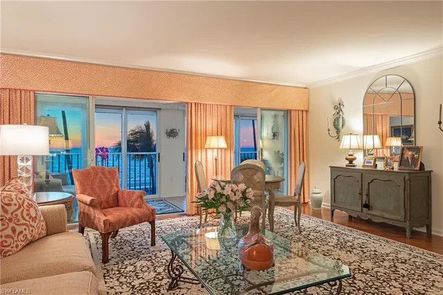 a kitchen with a stove and a wooden floor