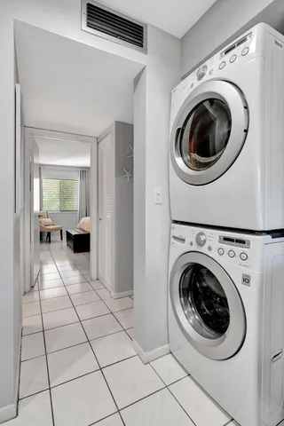 a view of a hallway with washer and dryer