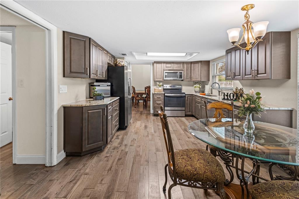 1437 Glenview Road Palm Harbor, FL 34683 - Photo 35 of 69 a kitchen with granite countertop lots of counter top space and stainless steel appliances