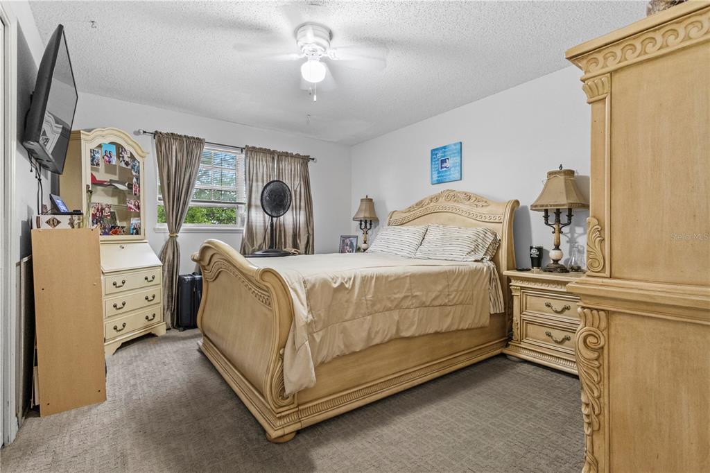 1437 Glenview Road Palm Harbor, FL 34683 - Photo 41 of 69 a bedroom with bed and window