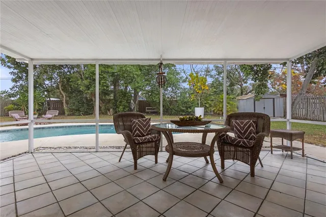 a view of a swimming pool with a yard