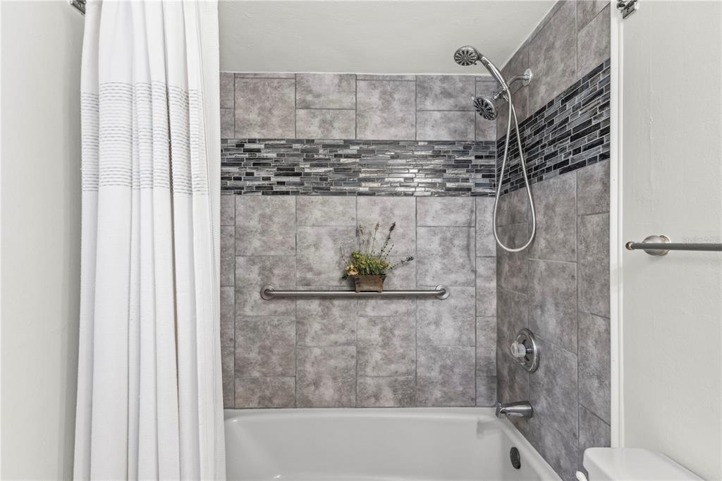 1437 Glenview Road Palm Harbor, FL 34683 - Photo 65 of 69 a bathroom with a shower