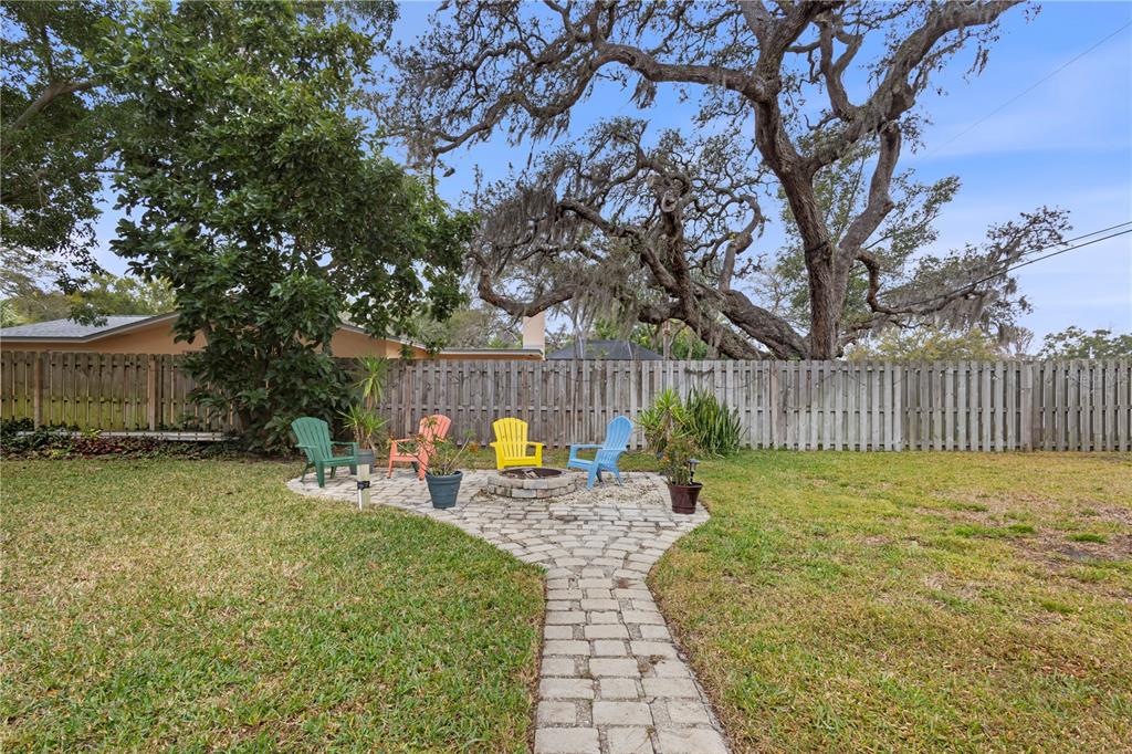 1437 Glenview Road Palm Harbor, FL 34683 - Photo 7 of 69 a view of a garden with a slide