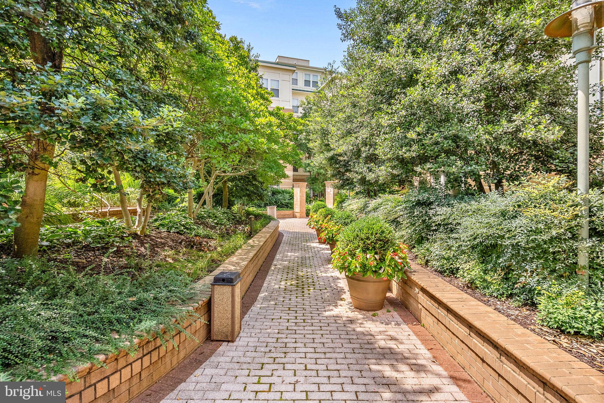 12001 Market Street, Unit 106 Reston, VA 20190 - Photo 36 of 45 a view of a pathway both side of the house