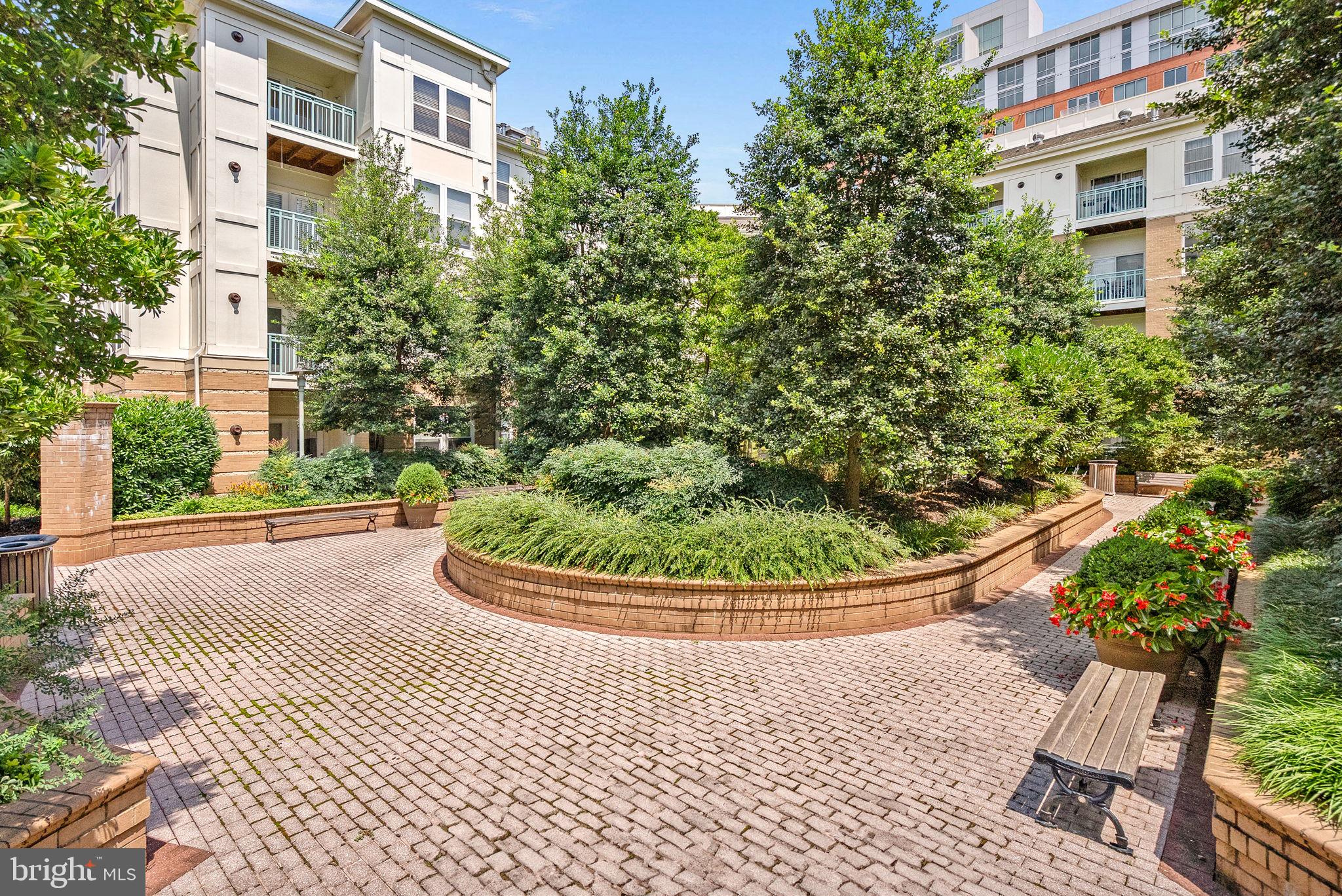 12001 Market Street, Unit 106 Reston, VA 20190 - Photo 38 of 45 a view of a white house with a sink and garden