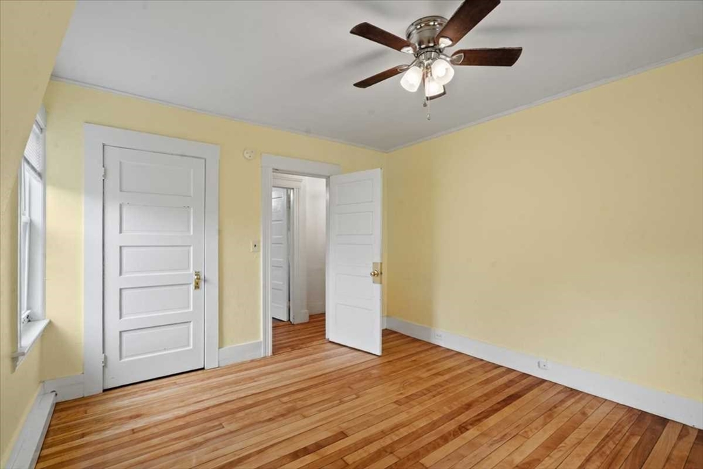 3 Wallace Street Worcester, MA 01605 - Photo 15 of 29 a view of empty room with wooden floor
