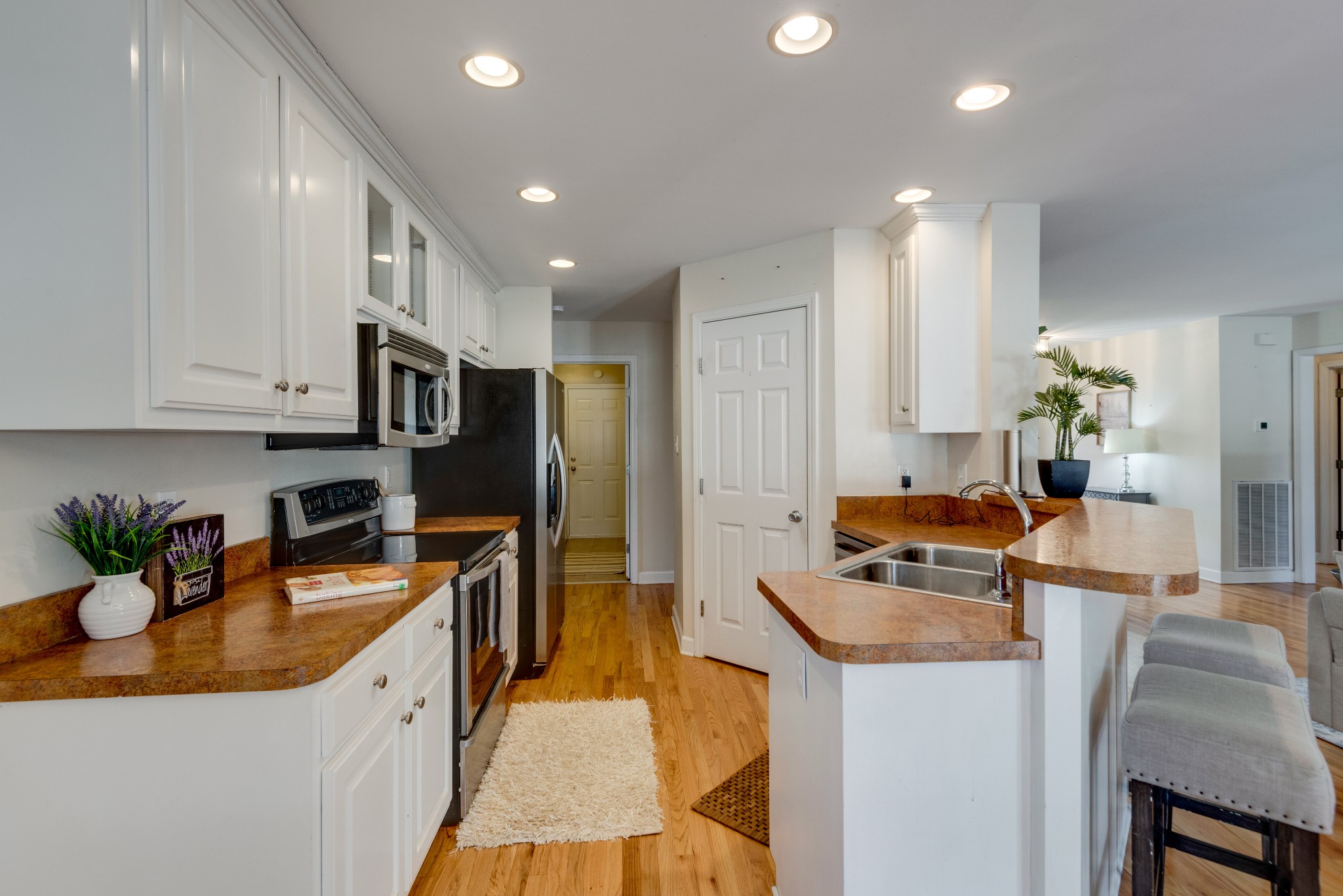 423 Pruett Road Dickson, TN 37055 - Photo 12 of 36 a kitchen with stainless steel appliances granite countertop sink stove refrigerator and cabinets
