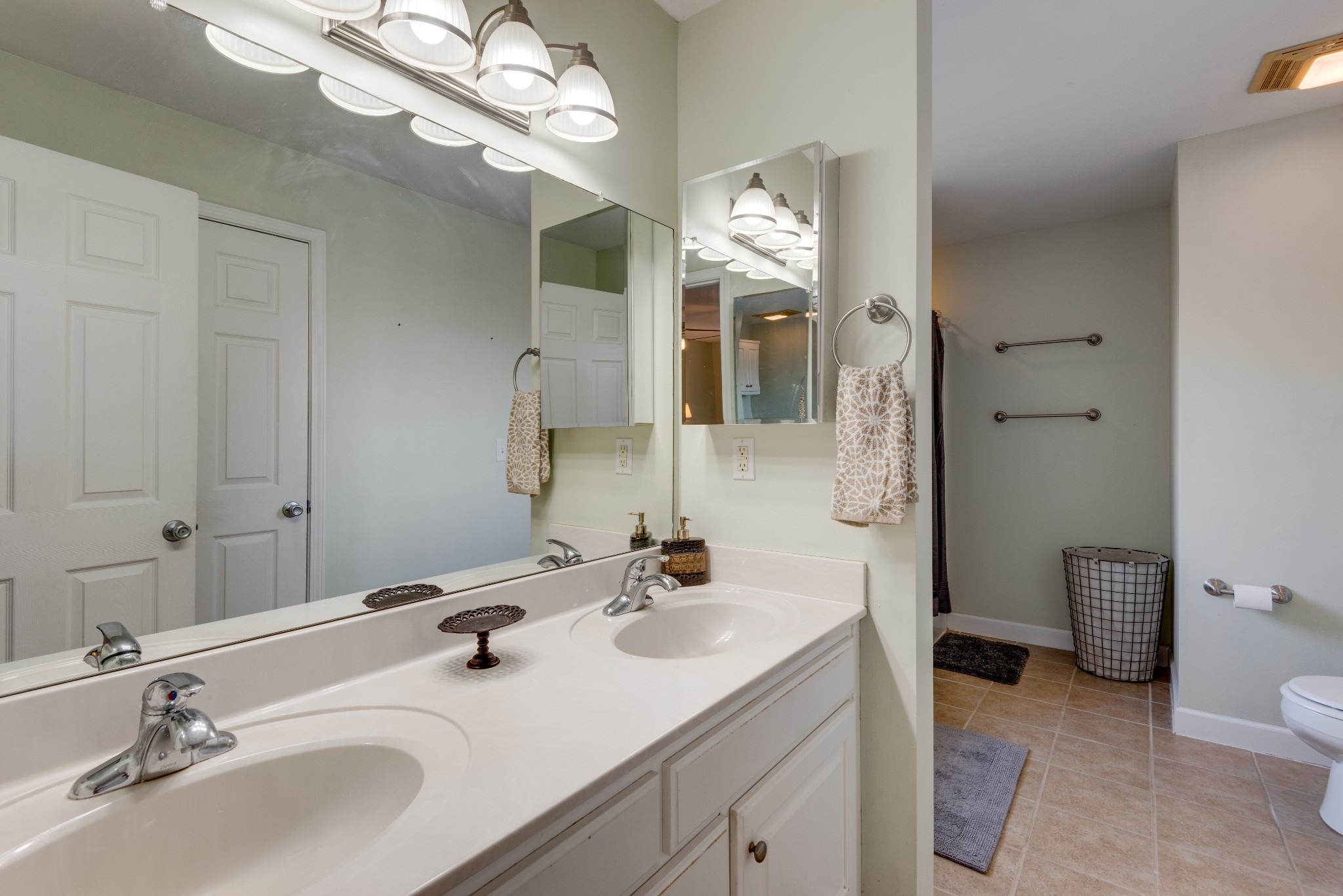 423 Pruett Road Dickson, TN 37055 - Photo 15 of 36 a bathroom with a sink a toilet and a mirror