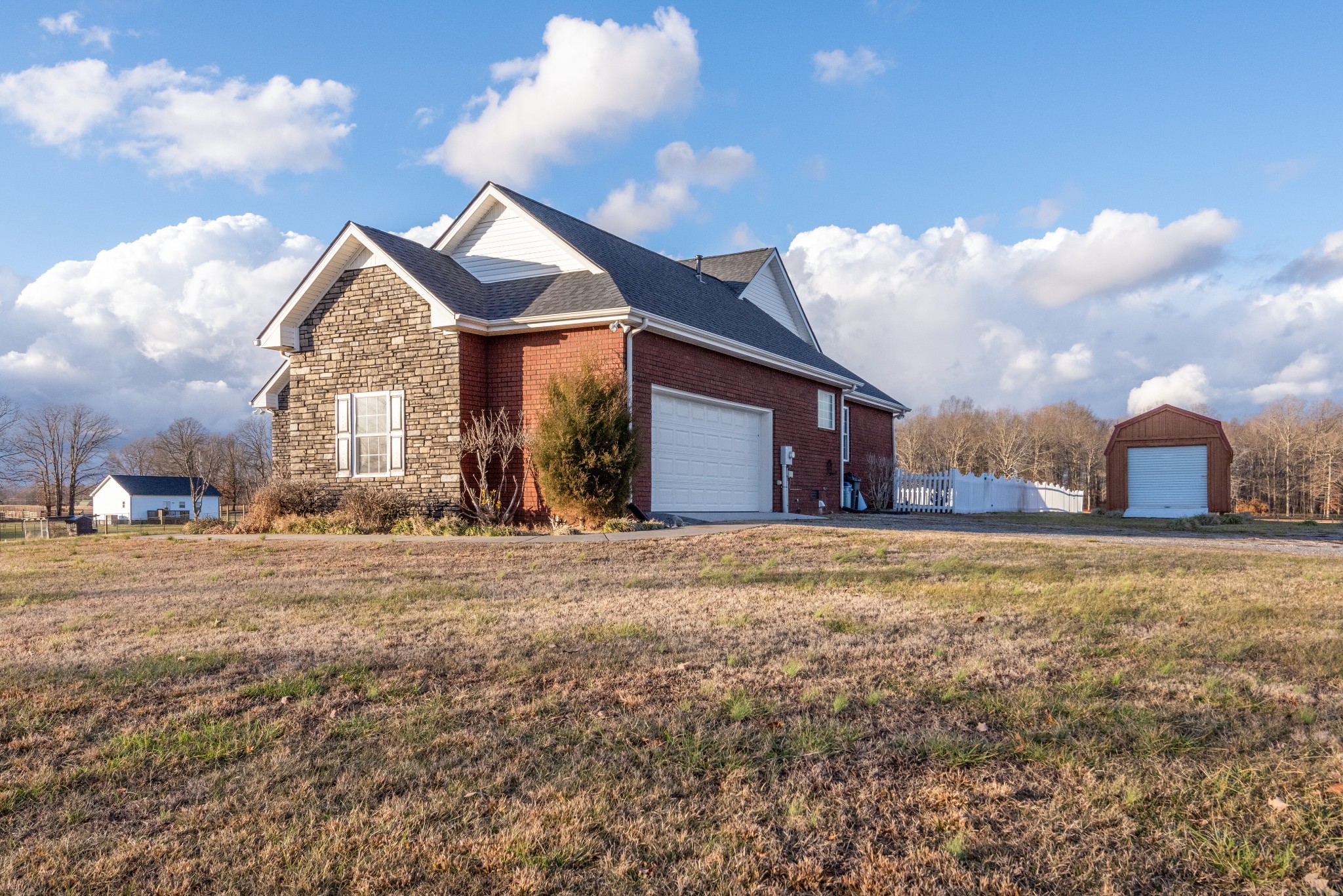 423 Pruett Road Dickson, TN 37055 - Photo 25 of 36 a front view of a house with a yard and garage