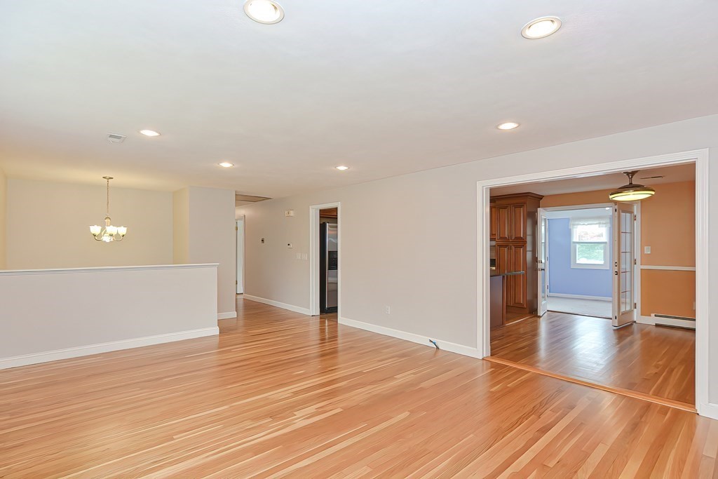 11 Bellwood Way Framingham, MA 01701 - Photo 11 of 42 a view of an empty room with wooden floor and a window