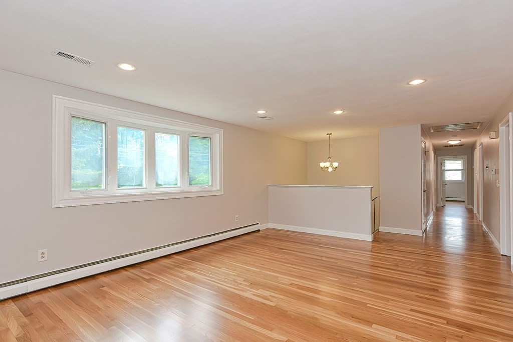 11 Bellwood Way Framingham, MA 01701 - Photo 12 of 42 wooden floor in an empty room with a window