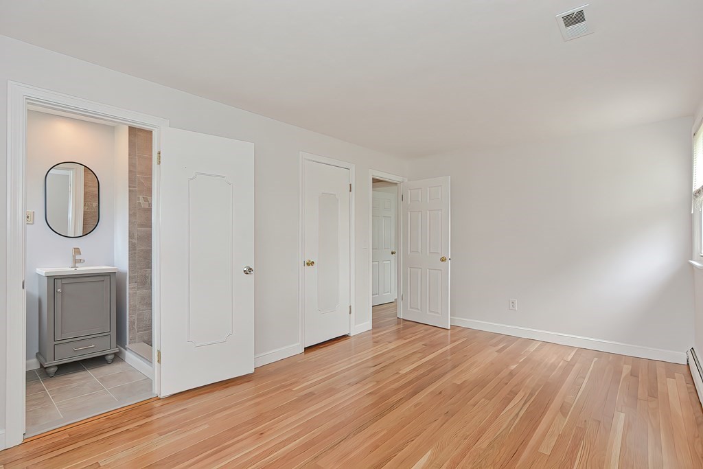 11 Bellwood Way Framingham, MA 01701 - Photo 15 of 42 a view of a room with wooden floor and a sink