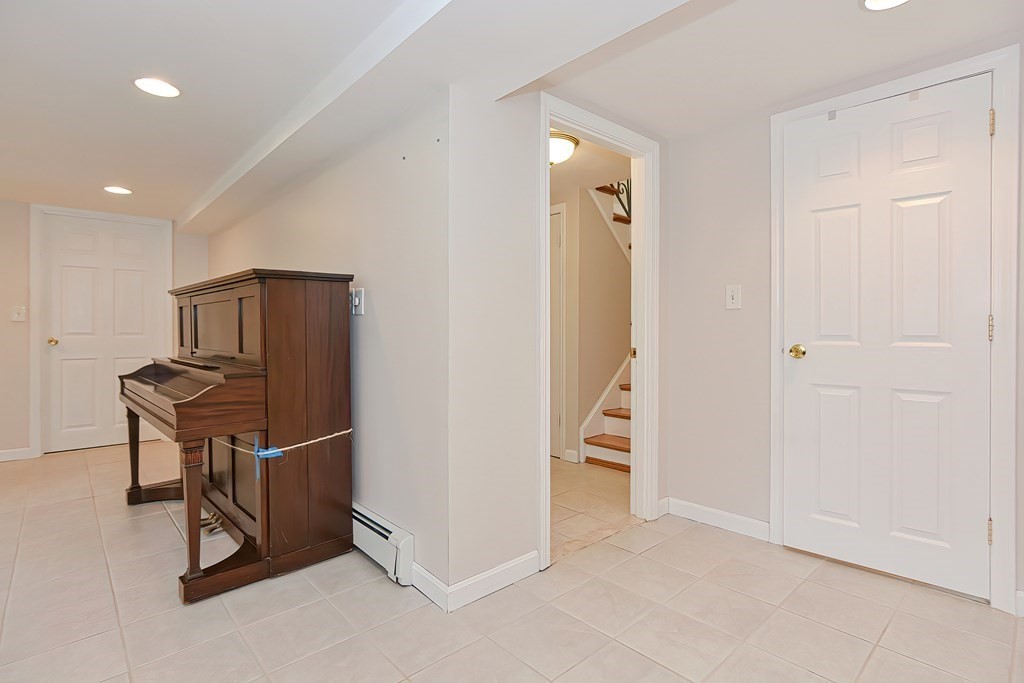 11 Bellwood Way Framingham, MA 01701 - Photo 27 of 42 a view of an empty room with wooden floor