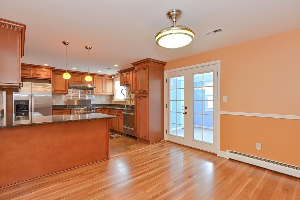 11 Bellwood Way Framingham, MA 01701 - Photo 3 of 42 a kitchen with stainless steel appliances granite countertop a refrigerator and a stove top oven