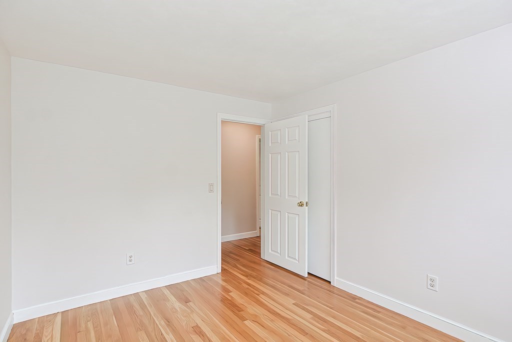 11 Bellwood Way Framingham, MA 01701 - Photo 31 of 42 a view of an empty room with wooden floor