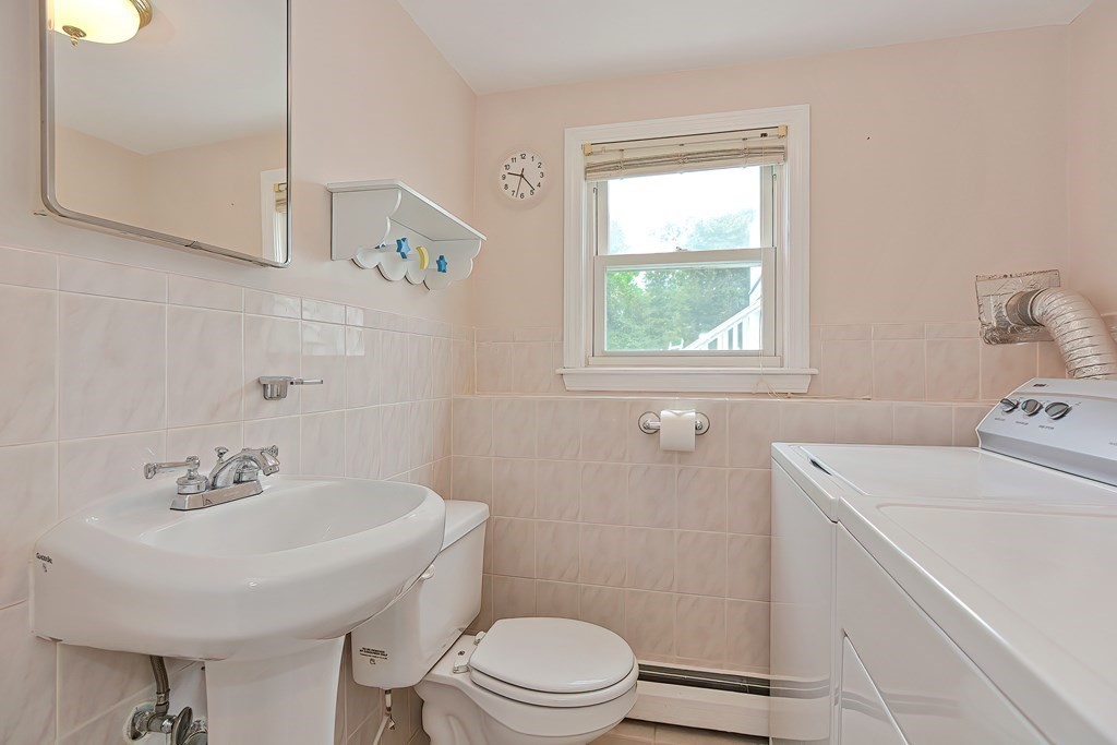 11 Bellwood Way Framingham, MA 01701 - Photo 32 of 42 a bathroom with a sink a toilet and a window
