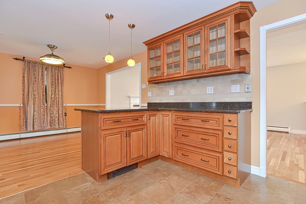 11 Bellwood Way Framingham, MA 01701 - Photo 7 of 42 a kitchen with stainless steel appliances granite countertop a sink and cabinets