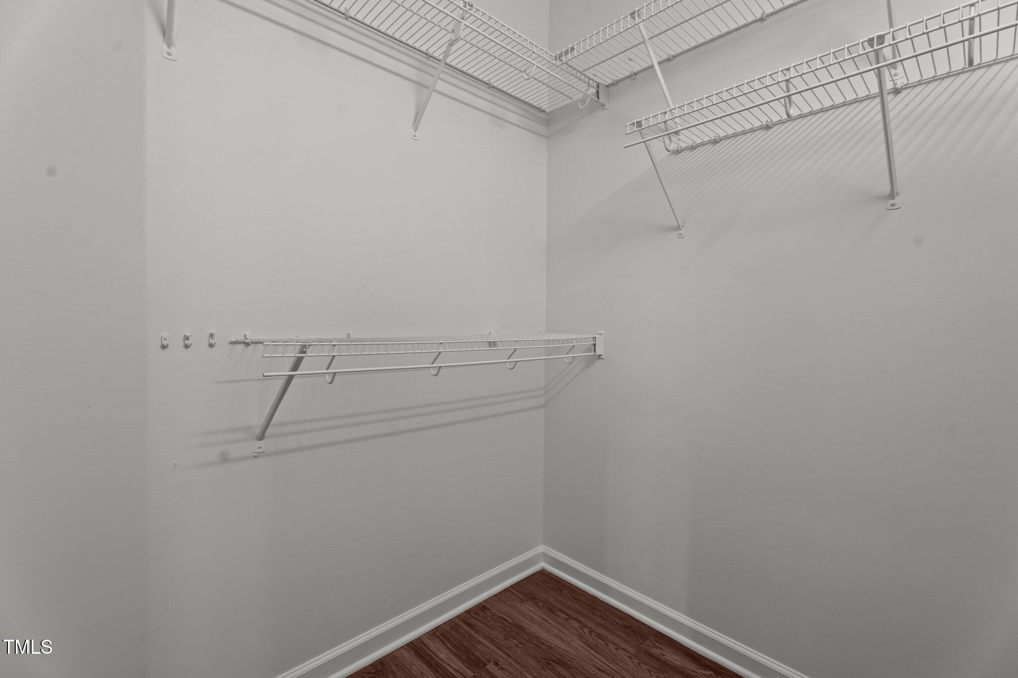 3624 Singleleaf Lane Raleigh, NC 27616 - Photo 30 of 40 a view of a room with racks on the wall