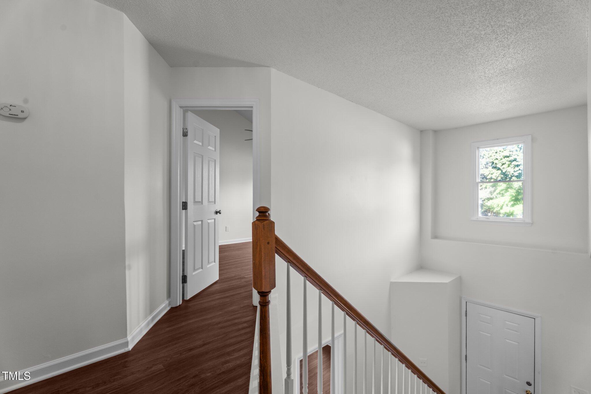 3624 Singleleaf Lane Raleigh, NC 27616 - Photo 33 of 40 a view of a hallway with wooden floor and entryway