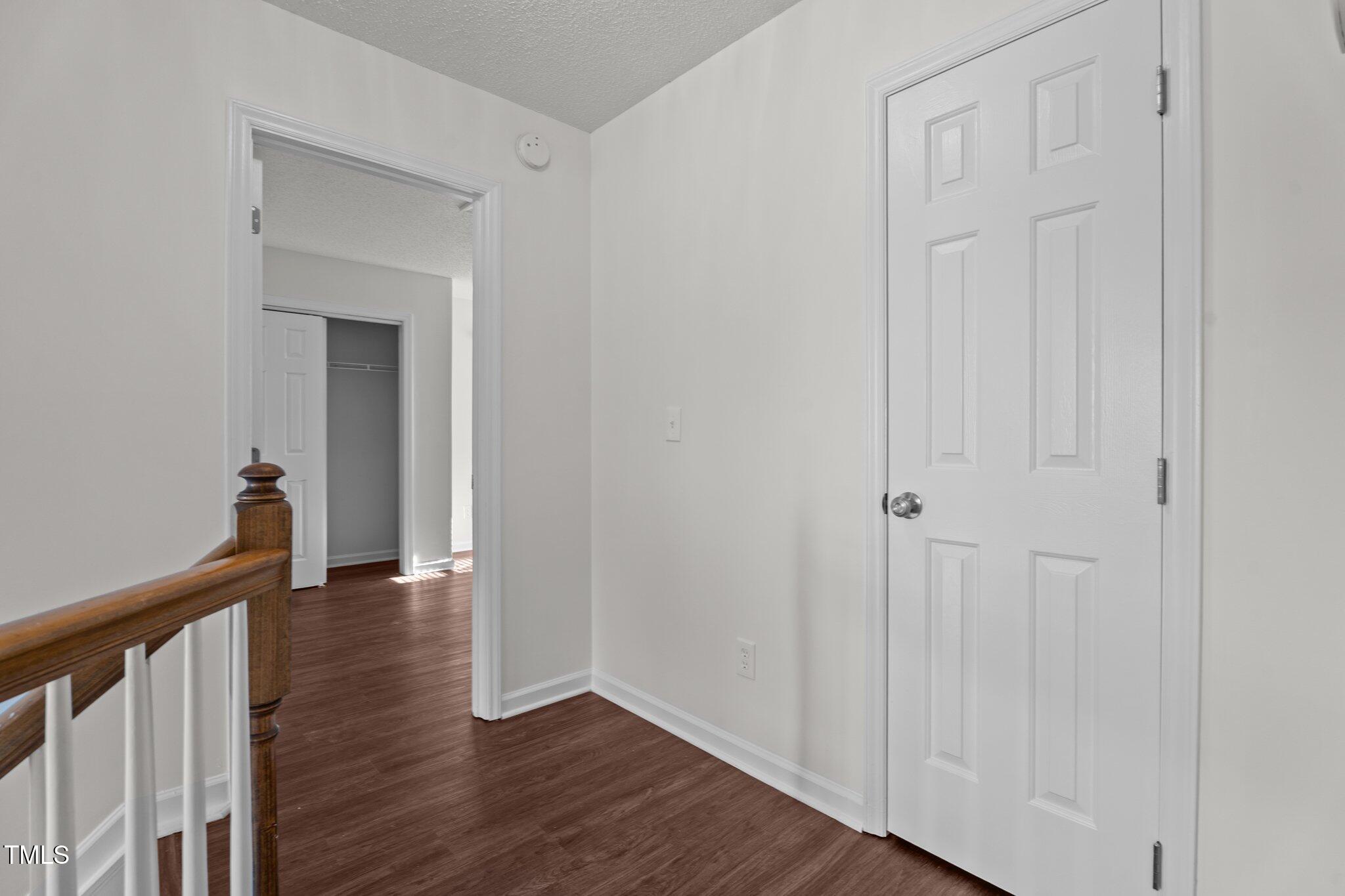 3624 Singleleaf Lane Raleigh, NC 27616 - Photo 34 of 40 a view of a hallway with wooden floor