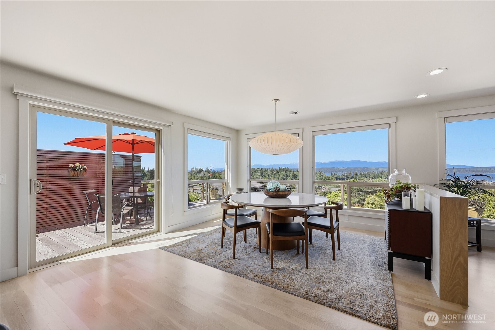 37709 Olympic View Road Northeast Hansville, WA 98340 - Photo 14 of 40 a dining room with furniture a window and a kitchen view