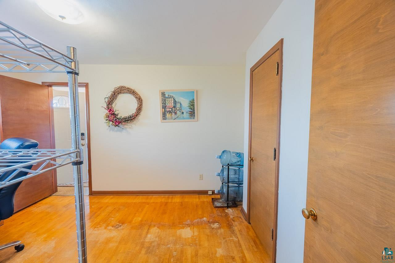 101 2nd Avenue North Biwabik, MN 55708 - Photo 21 of 44 Wood-finish flooring throughout, complemented by light-toned walls and wood-panel doors