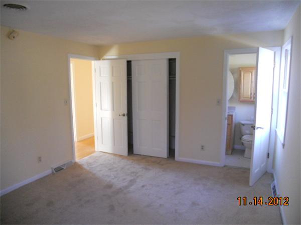 6 Lewis Road Foxboro, MA 02035 - Photo 8 of 12 a view of an empty room and a window