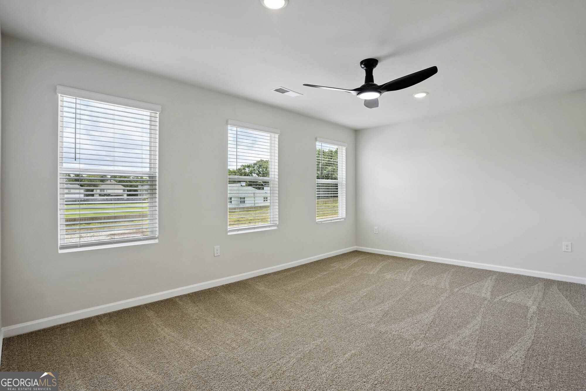 11516 Kimberly Way Hampton, GA 30228 - Photo 18 of 39 a view of an empty room with a window