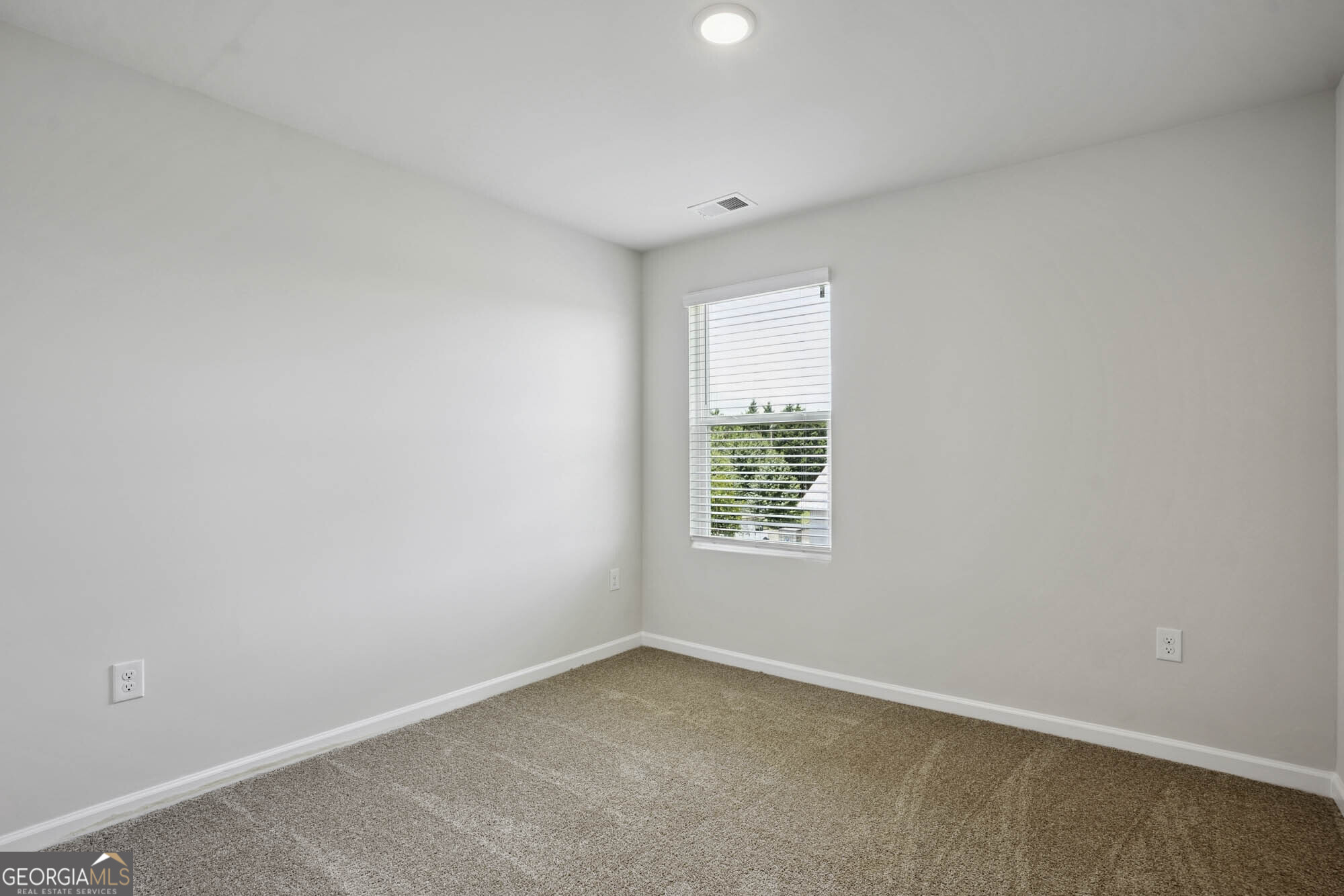 11516 Kimberly Way Hampton, GA 30228 - Photo 29 of 39 an empty room with a window