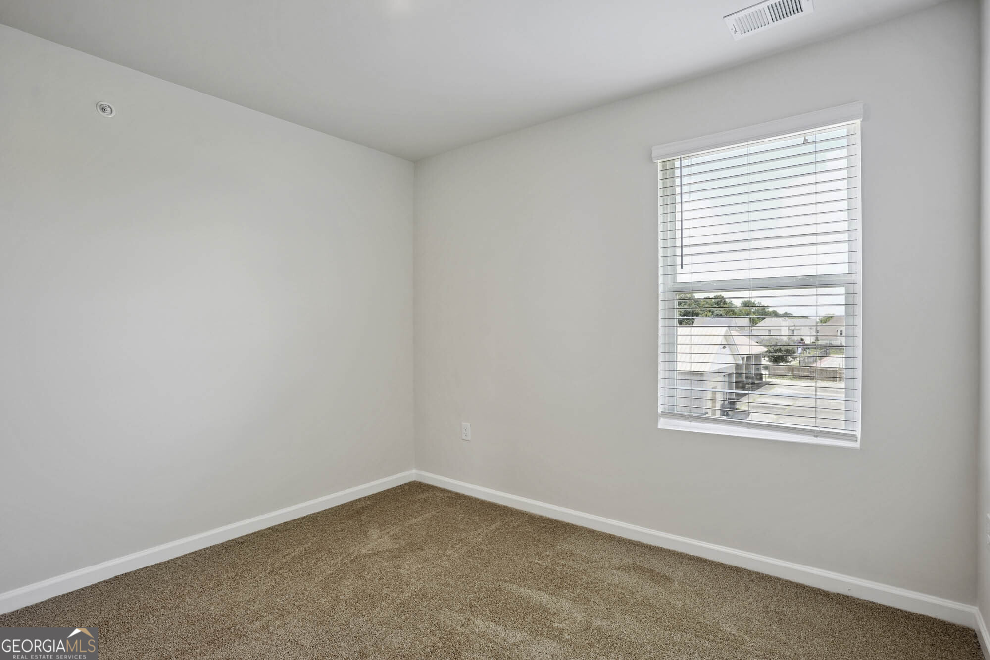 11516 Kimberly Way Hampton, GA 30228 - Photo 35 of 39 an empty room with a window
