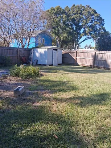 a view of a backyard with tree s
