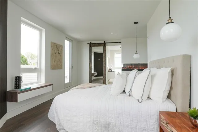 a bed room with a bed and a window