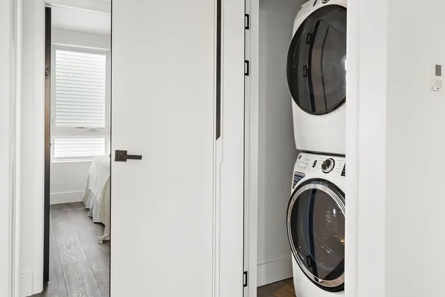 a close view of a utility room with washer and dryer