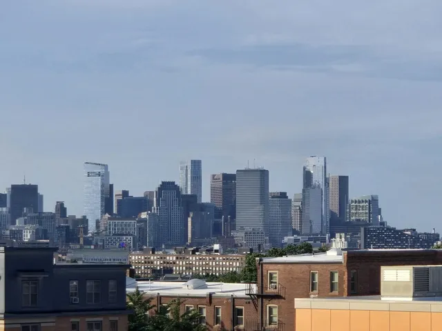 a view of a city with tall buildings