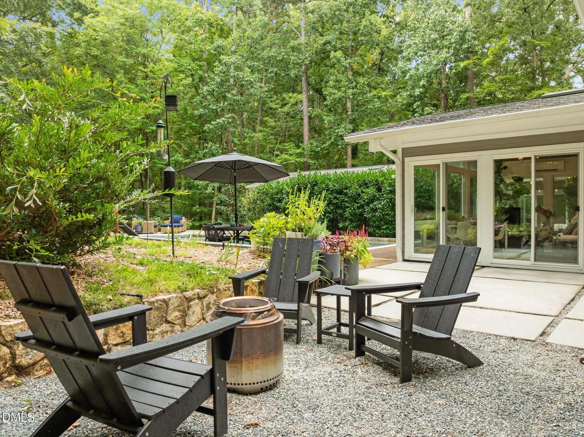 1812 Rolling Road Chapel Hill, NC 27514 - Photo 58 of 72 a view of a chairs and table in backyard