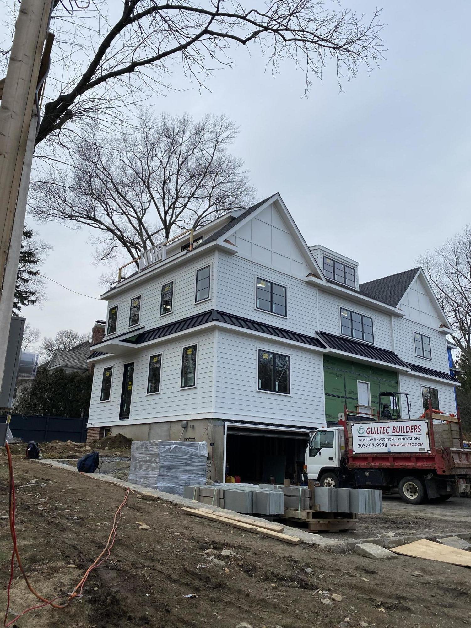 2 Winthrop Drive Riverside, CT 06878 - Photo 2 of 10 a front view of a house with a yard