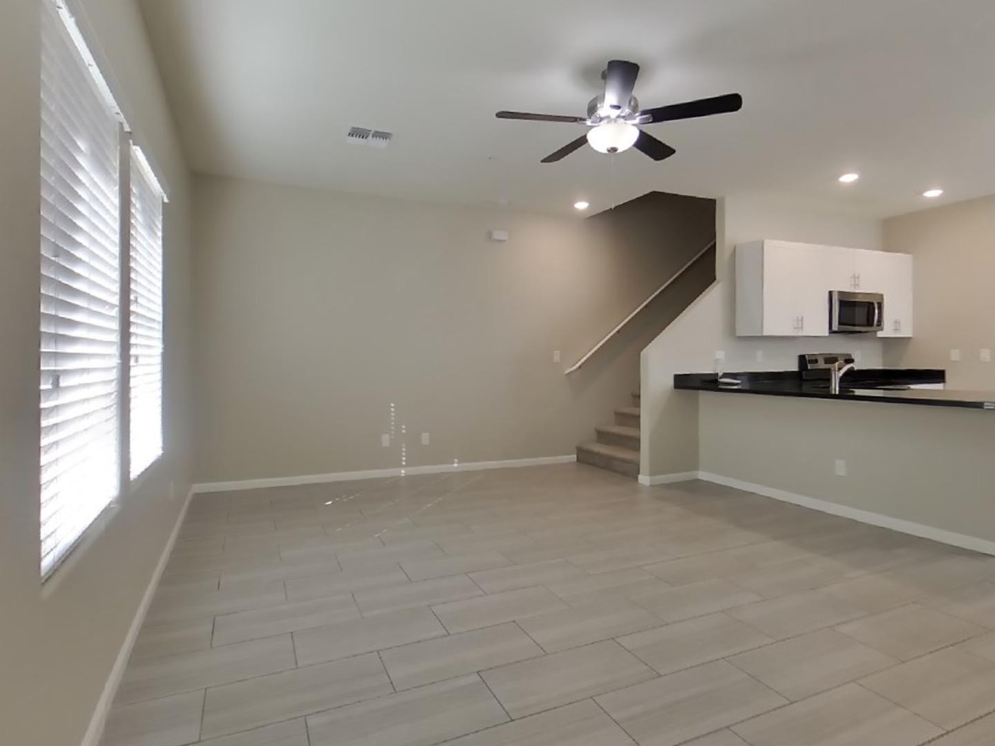 12565 West Via Dona Road Peoria, AZ 85383 - Photo 4 of 17 a view of an empty room with a window