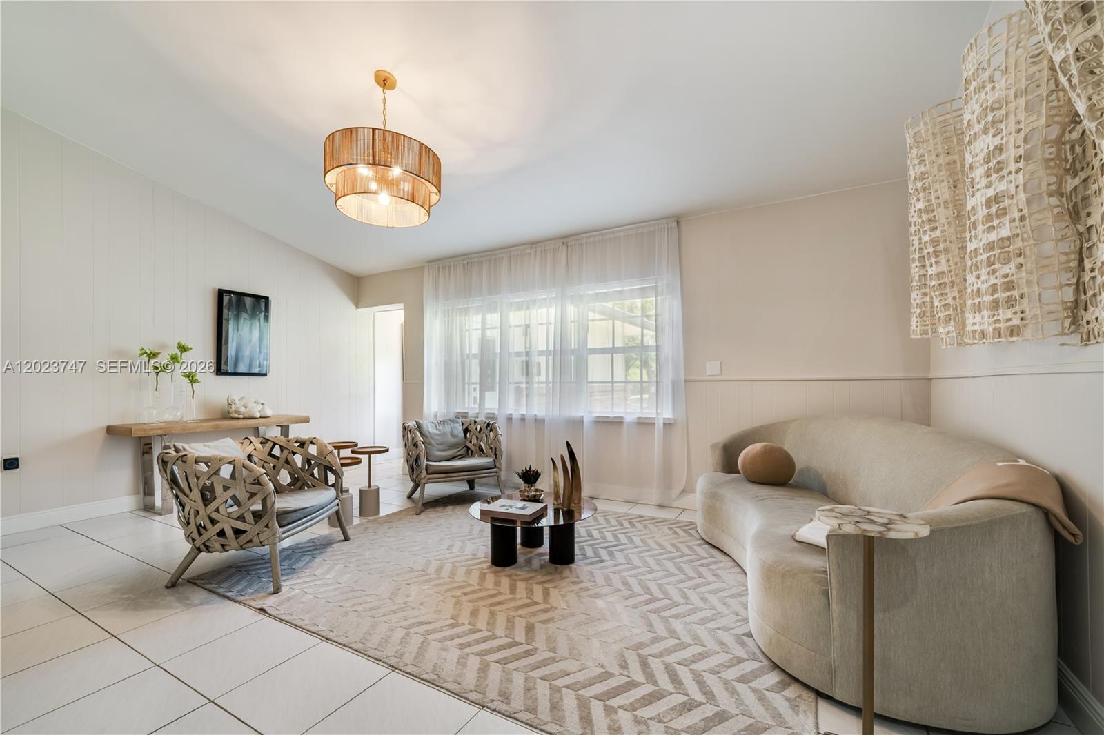 11515 Southwest 81st Road, Unit 11515 Pinecrest, FL 33156 - Photo 6 of 33 a living room with furniture and a window