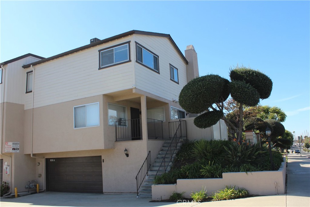 810 West Lambert Road, Unit A La Habra, CA 90631 - Photo 1 of 1 a front view of a house with a yard and garage