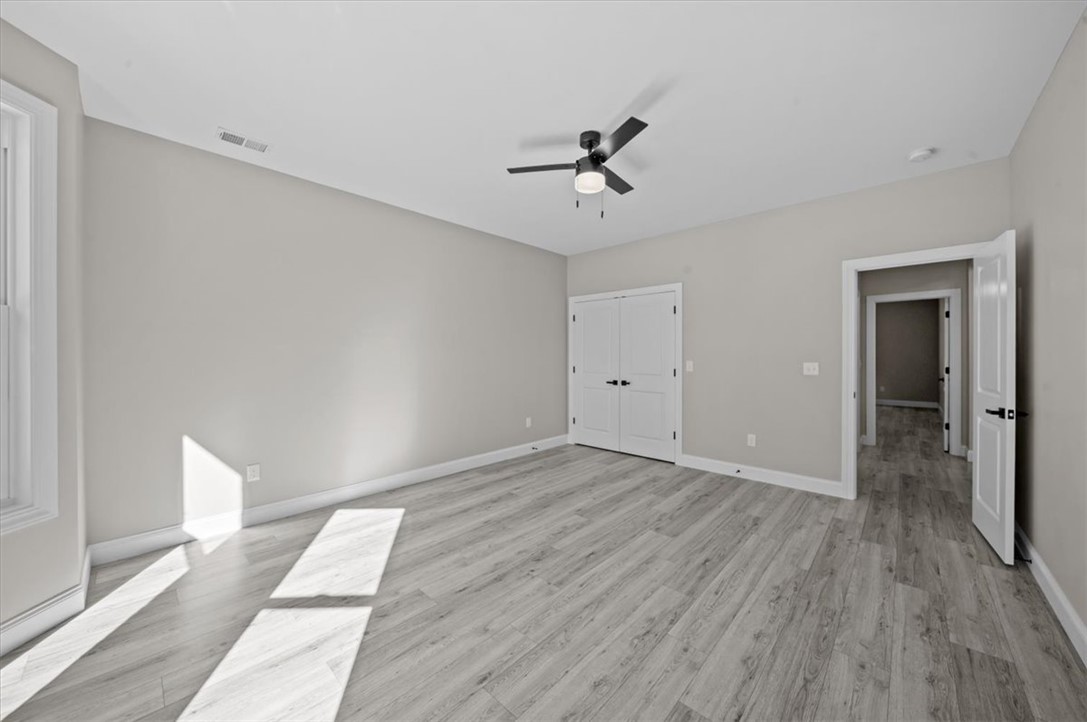105 Bree Drive Anderson, SC 29621 - Photo 33 of 48 A versatile room, freshly painted, features light wood-look flooring and ample natural illumination.