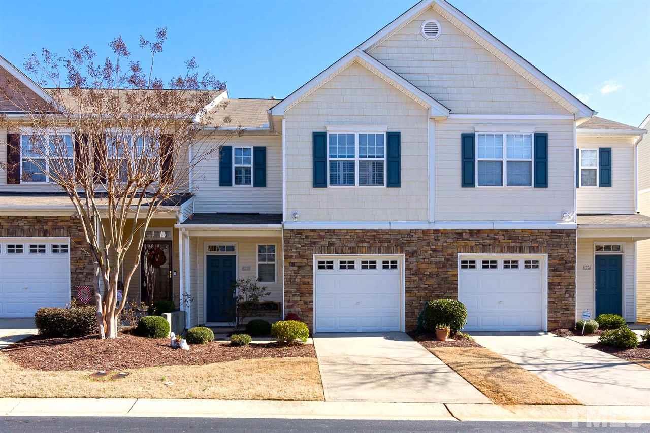 8228 Belneath Court Raleigh, NC 27613 - Photo 1 of 17 a front view of a house with yard