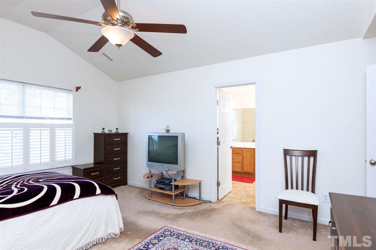 8228 Belneath Court Raleigh, NC 27613 - Photo 11 of 17 a bedroom with furniture and a window