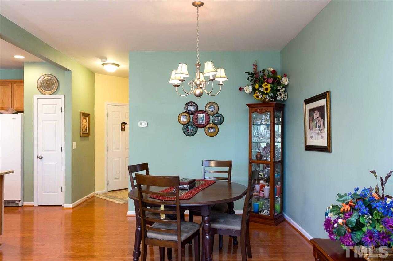 8228 Belneath Court Raleigh, NC 27613 - Photo 9 of 17 a view of a dining room with furniture and chandelier