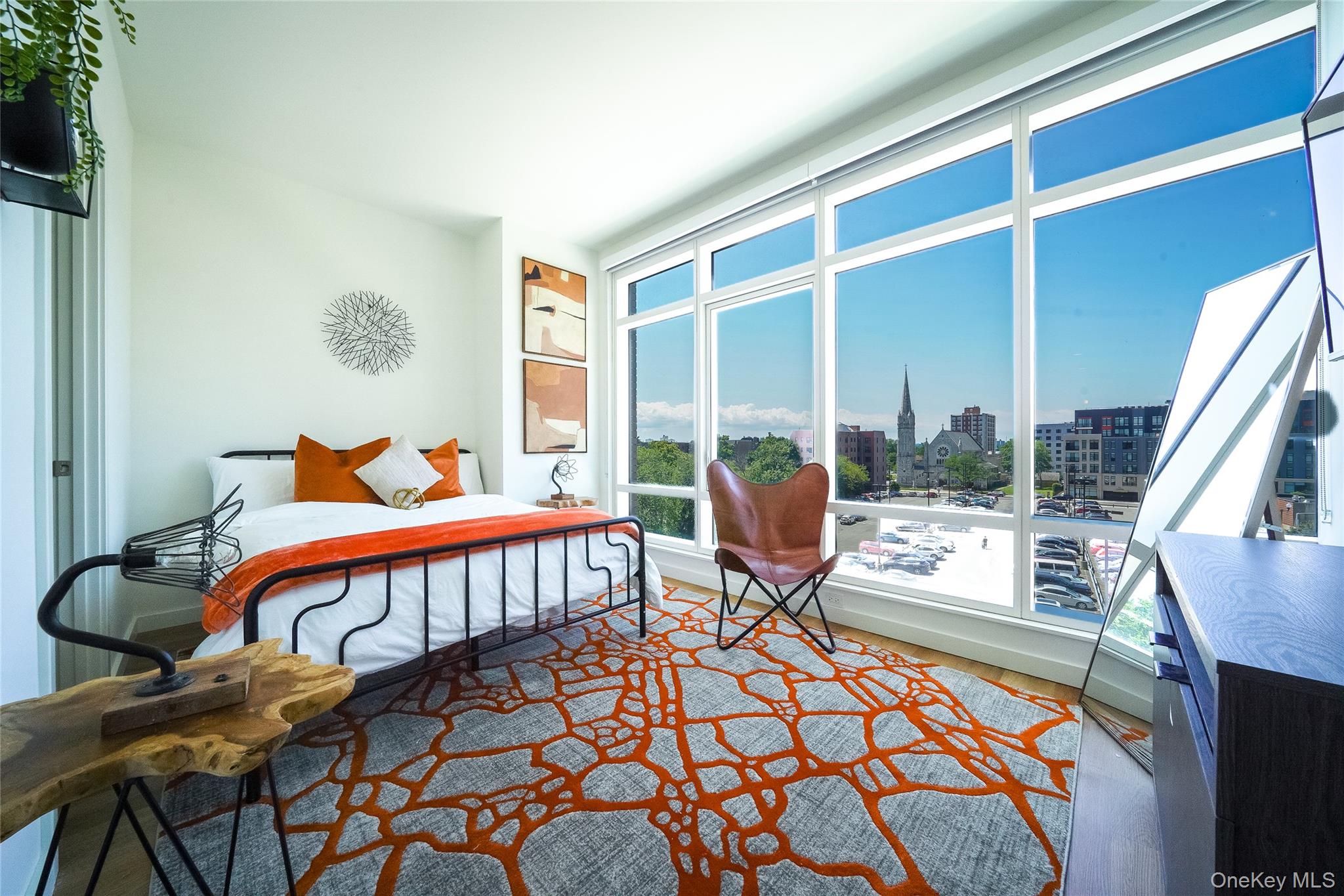 50 Clinton Place, Unit LOCUST STREET New Rochelle, NY 10801 - Photo 4 of 15 a bedroom with a bed and wooden floor