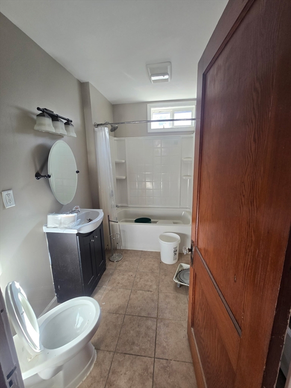 1942 Acushnet Avenue, Unit 2 New Bedford, MA 02745 - Photo 3 of 10 a bathroom with a toilet and a shower