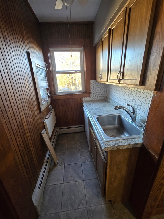 1942 Acushnet Avenue, Unit 2 New Bedford, MA 02745 - Photo 6 of 10 a kitchen with a sink a washer and dryer